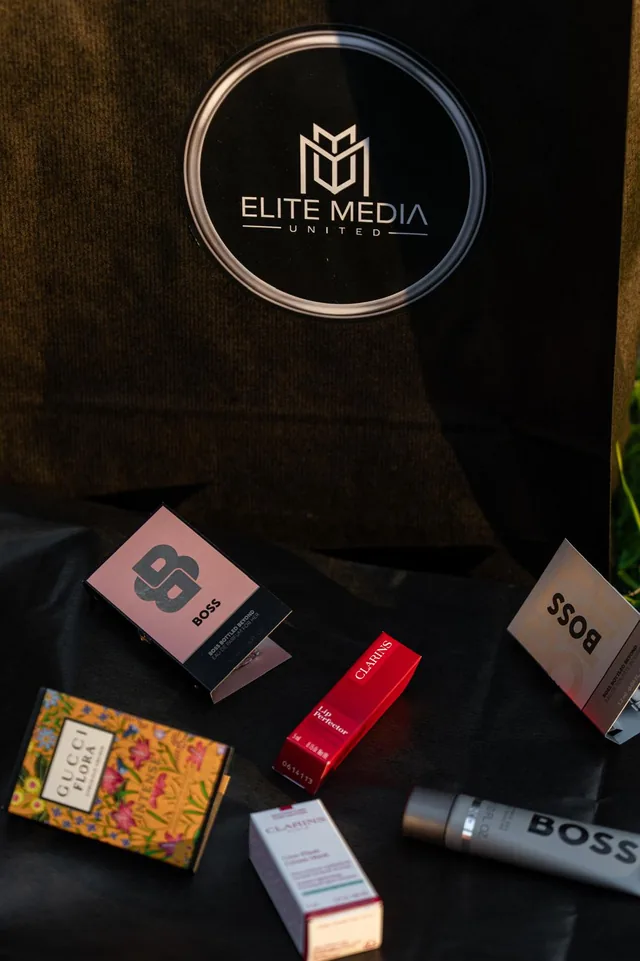 Elite Media United signage and brand products displayed at an event