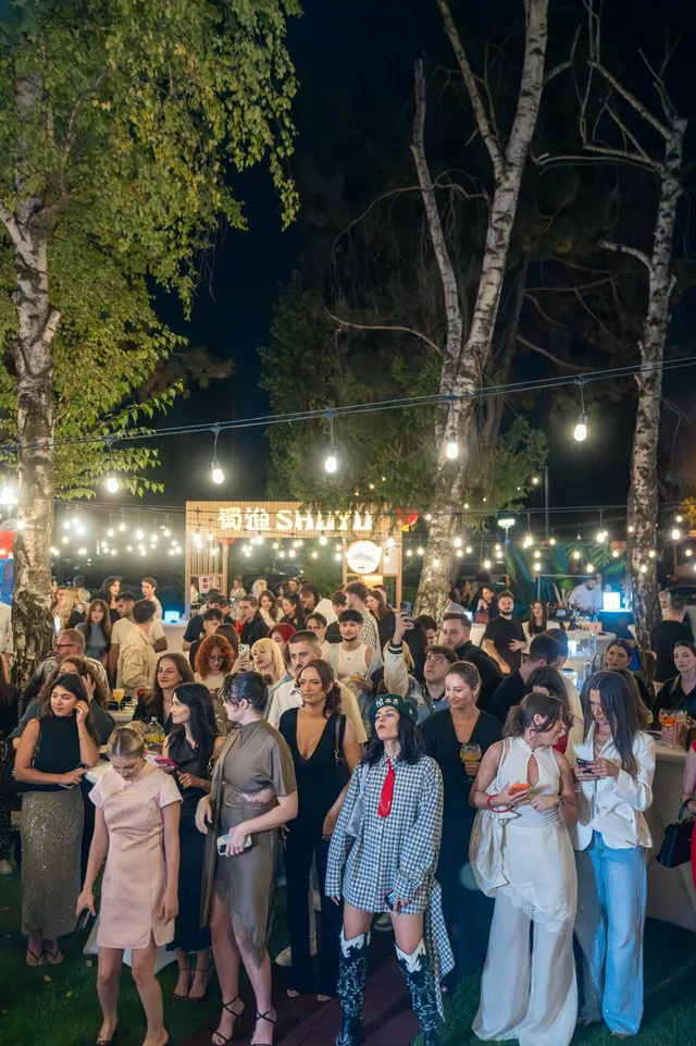 Creators and guests gathered at an Elite Media United outdoor event